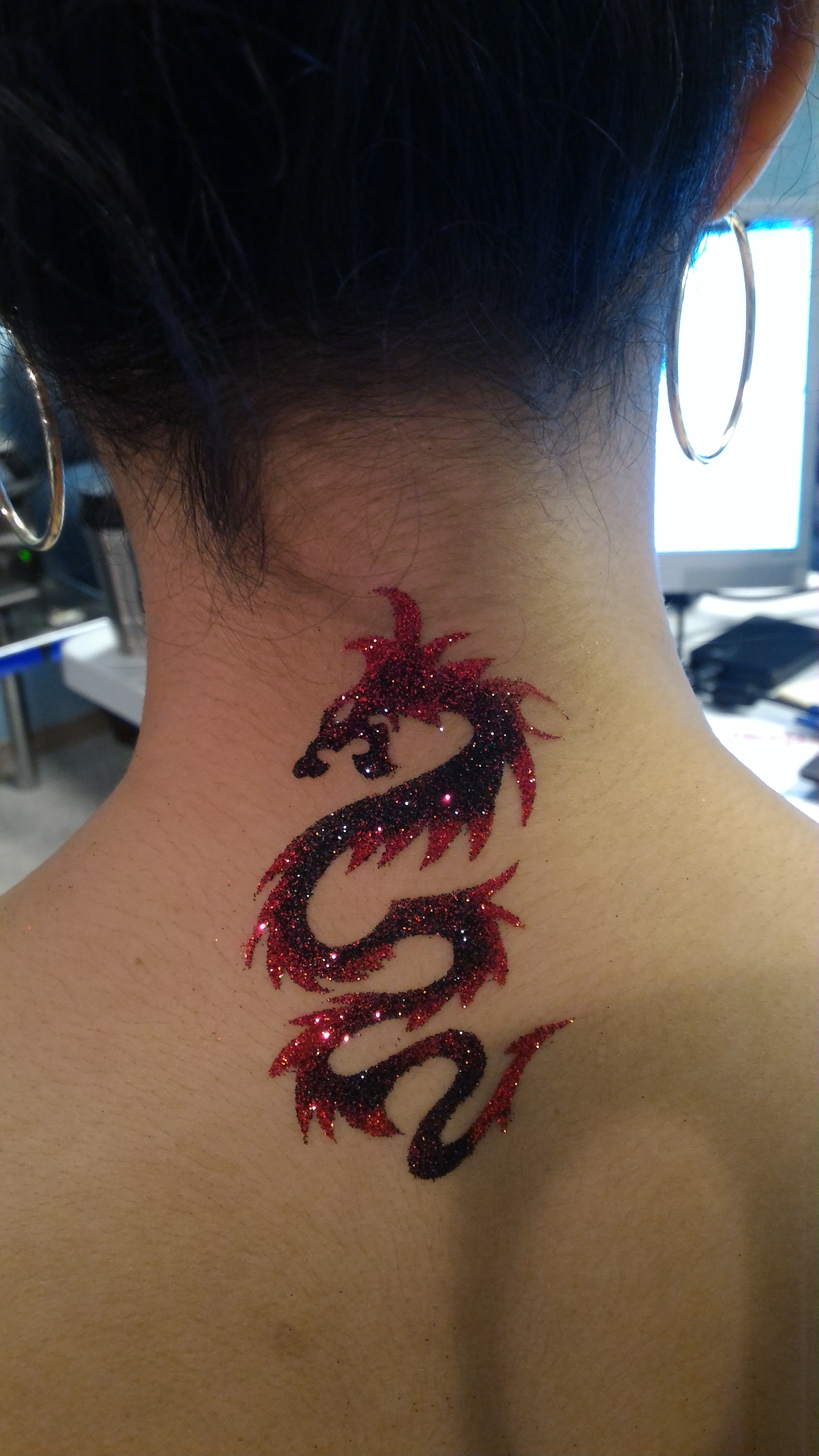 Dragon Tattoo on neck - TriXtan Entertainment inc.
